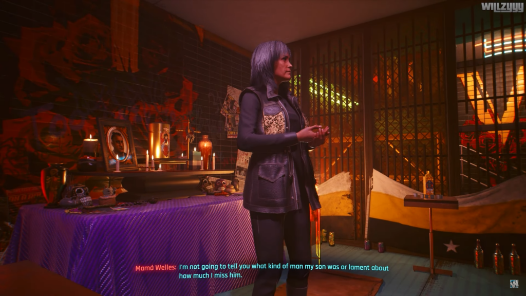 A screenshot from Cyberpunk 2077, a video game. The image depicts a mother giving a speech at her late son's ofrenda.